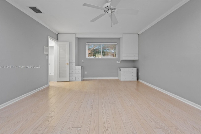 empty room featuring crown molding, ceiling fan, and light wood-type flooring