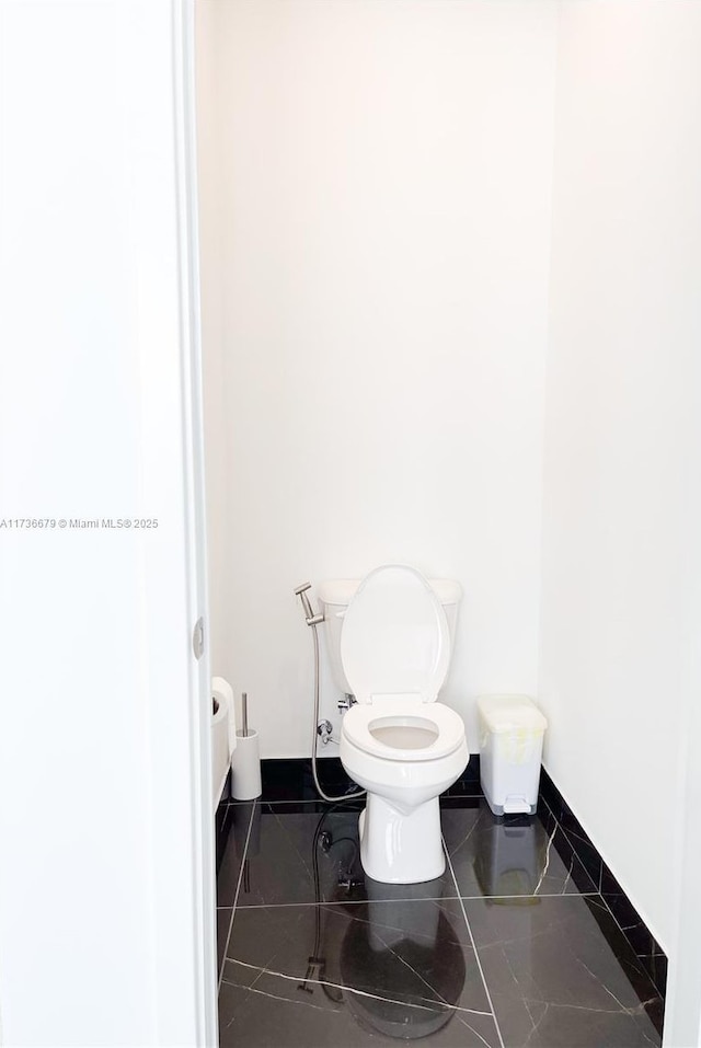 bathroom featuring toilet