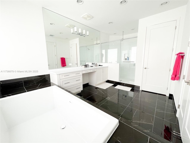 bathroom with vanity and separate shower and tub