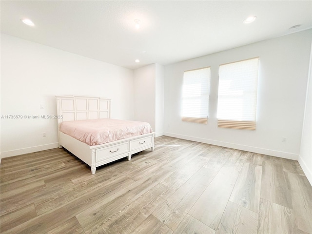 unfurnished bedroom featuring light wood-type flooring