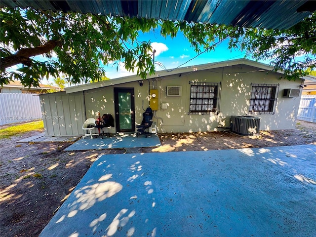 view of front of house featuring a patio and central air condition unit