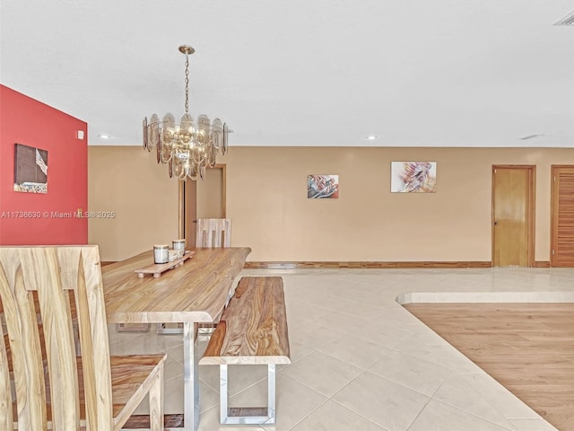 dining room with light tile patterned floors, baseboards, visible vents, a notable chandelier, and recessed lighting