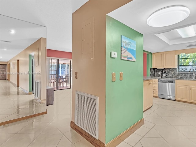 corridor with visible vents and light tile patterned flooring