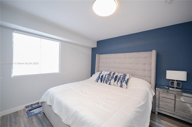 bedroom featuring dark wood-type flooring