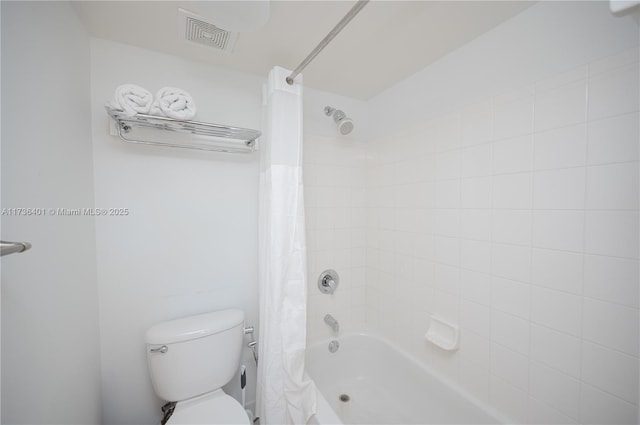 bathroom featuring shower / bath combination with curtain and toilet