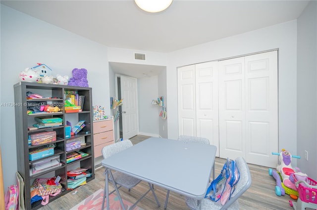 bedroom with hardwood / wood-style flooring and a closet