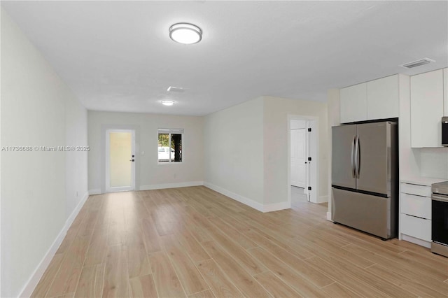 interior space with light hardwood / wood-style floors