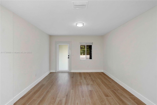 unfurnished room featuring light hardwood / wood-style flooring