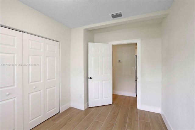 unfurnished bedroom with a closet