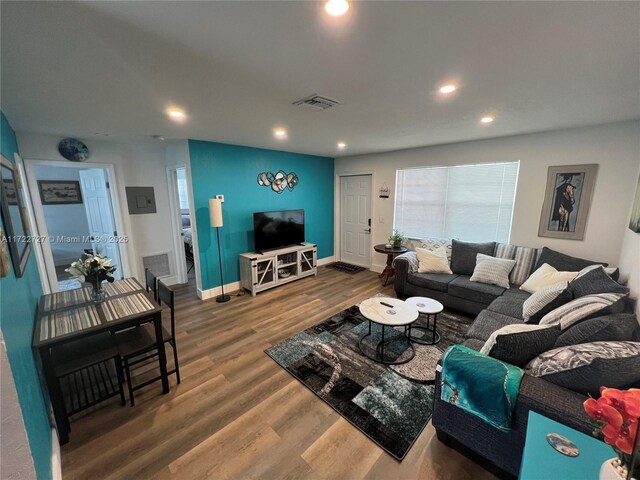 living room with hardwood / wood-style flooring