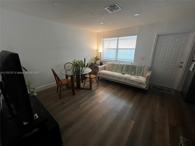 living room with dark wood-type flooring