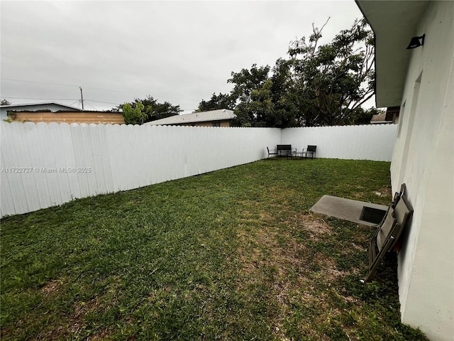 view of yard with a fenced backyard