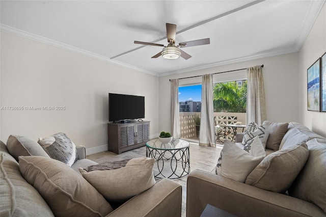 living room featuring ceiling fan and ornamental molding