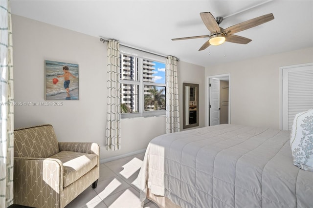 tiled bedroom with ceiling fan