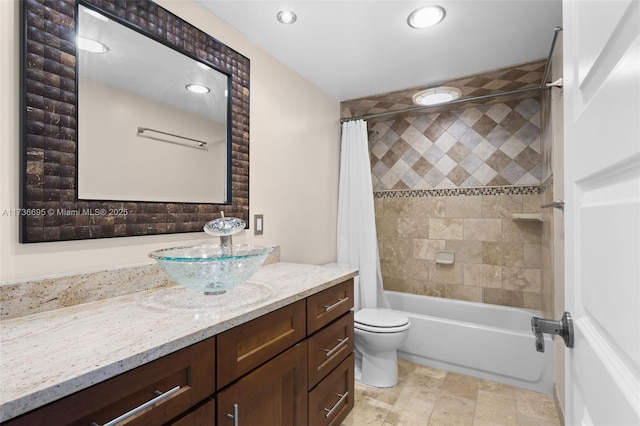 full bathroom with shower / bath combo, vanity, and toilet