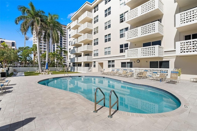 view of swimming pool featuring a patio area