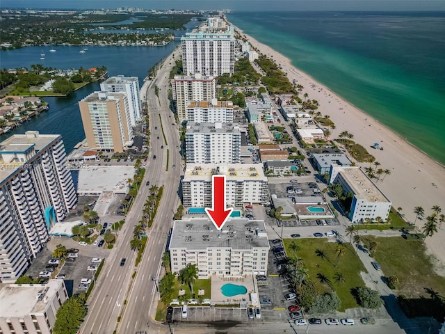 bird's eye view featuring a water view and a view of the beach