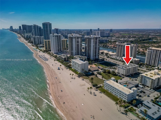 drone / aerial view with a view of the beach and a water view