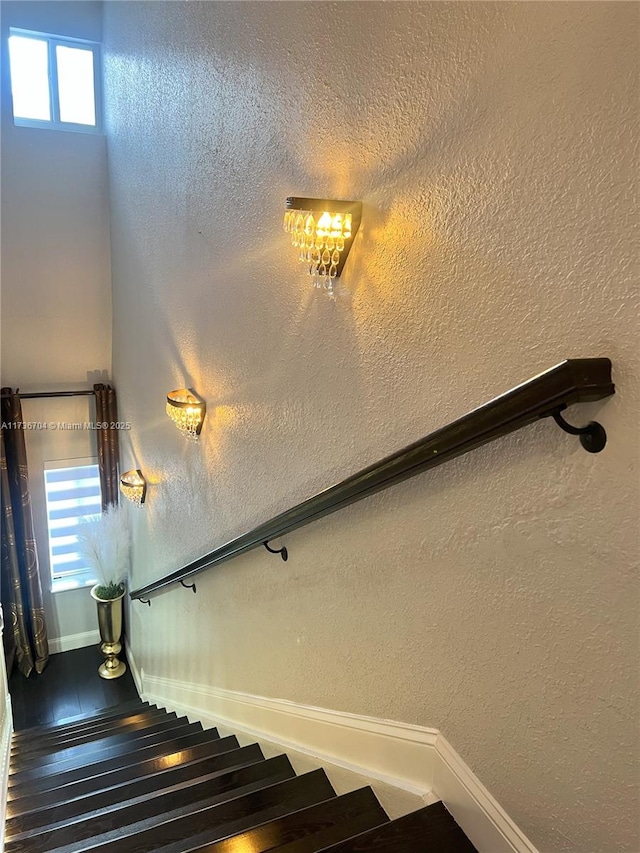 staircase with wood-type flooring