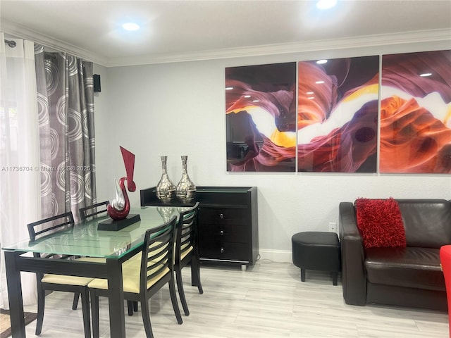 dining space with ornamental molding