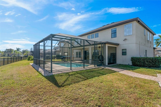 rear view of property with a fenced in pool, a yard, a patio area, and glass enclosure