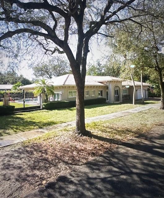 view of front facade with a garage and a front lawn