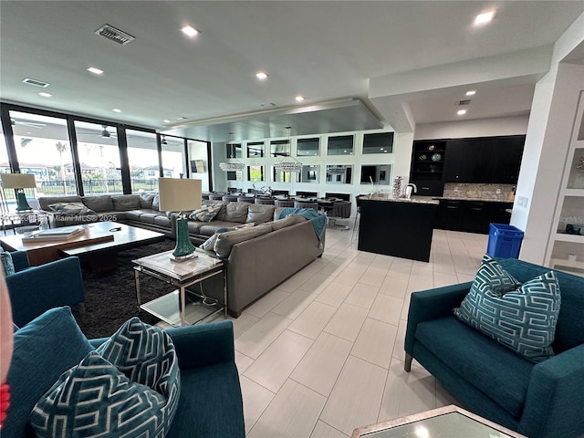 living room with floor to ceiling windows