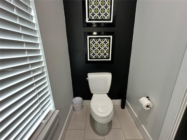 bathroom with tile patterned floors and toilet