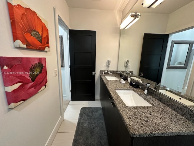 bathroom with vanity and tile patterned floors