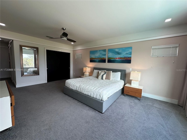 bedroom with ceiling fan and dark colored carpet