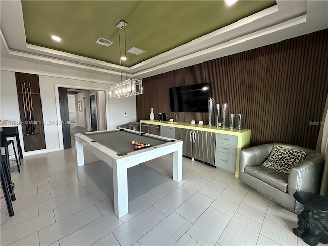 playroom with pool table and a raised ceiling