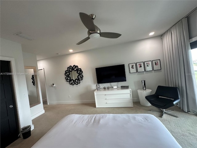 bedroom featuring light colored carpet and ceiling fan