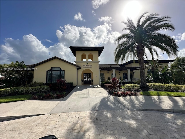 mediterranean / spanish-style house featuring french doors