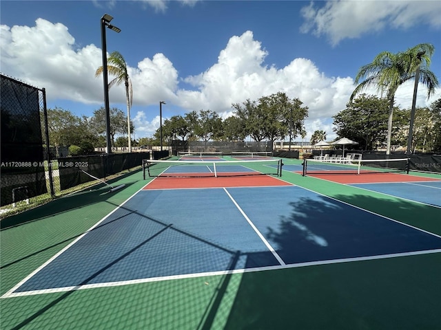 view of tennis court featuring basketball court