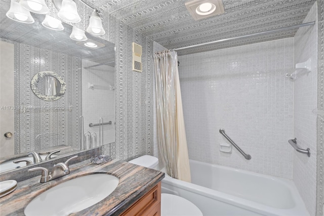 full bathroom with vanity, toilet, and shower / bath combo with shower curtain