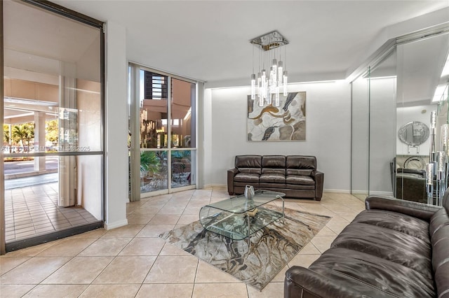 living room with an inviting chandelier and light tile patterned floors