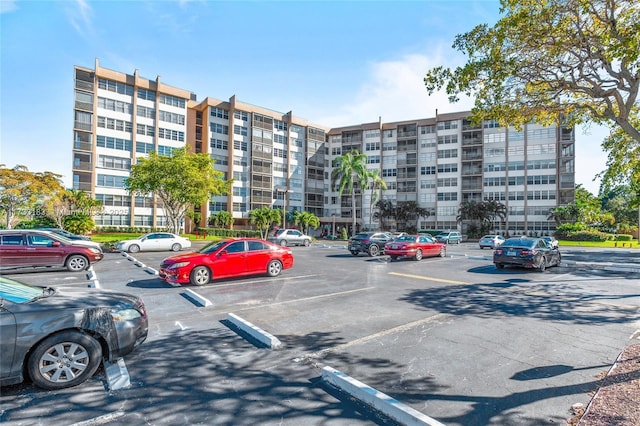 1200 Saint Charles Pl Unit Ph7, Pembroke Pines, FL 33026 - view of apartment building / complex featuring uncovered parking