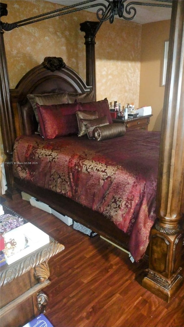 bedroom featuring hardwood / wood-style flooring