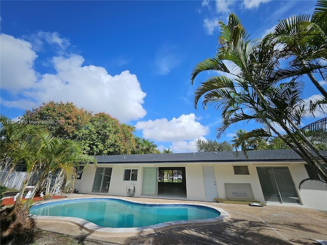 view of swimming pool with a patio