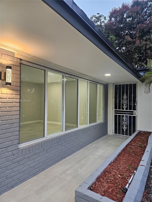 view of property exterior with a patio area