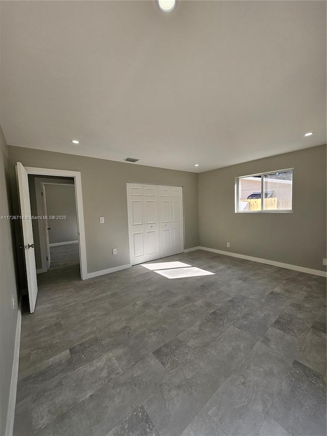 unfurnished bedroom with a closet