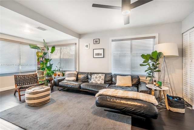 living room with wood-type flooring and ceiling fan