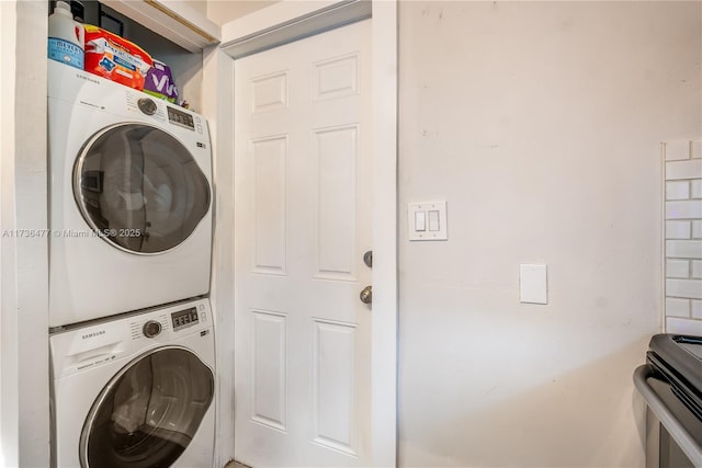 laundry room featuring stacked washer and clothes dryer