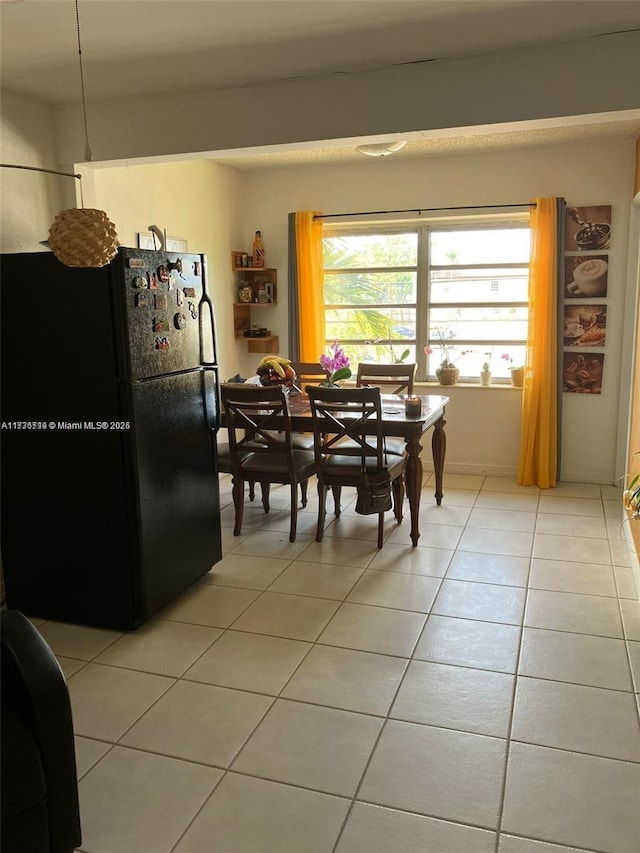 dining room with light tile patterned flooring