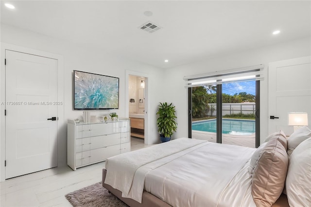 bedroom featuring ensuite bathroom and access to outside