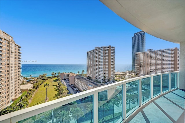 balcony featuring a water view