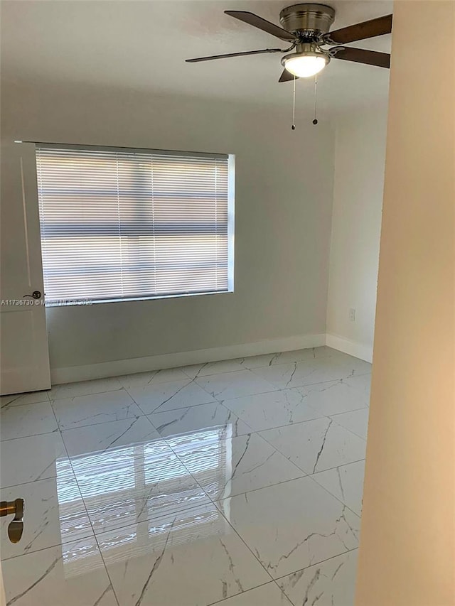 unfurnished room featuring ceiling fan