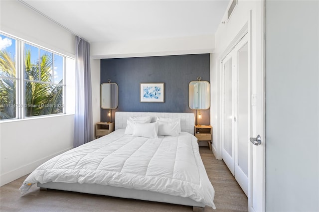 bedroom featuring hardwood / wood-style floors