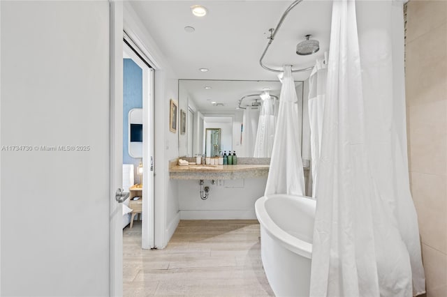 bathroom featuring sink and hardwood / wood-style floors