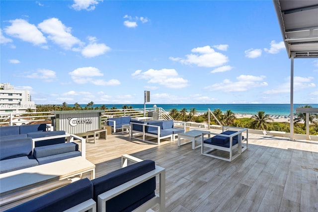 deck featuring a water view and outdoor lounge area